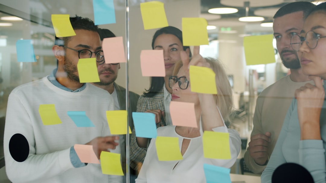 Team brainstorming strategy with sticky notes
